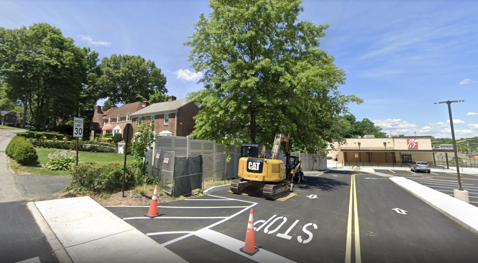 Angled view of Chick-fil-A drive-thru noise barrier wall